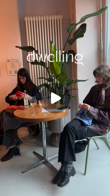 Two people knitting together in a Dwelling Sessions preview
