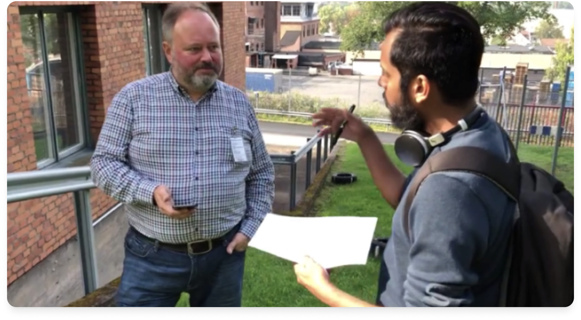 Designer interviewing a homeowner during outdoor field testing